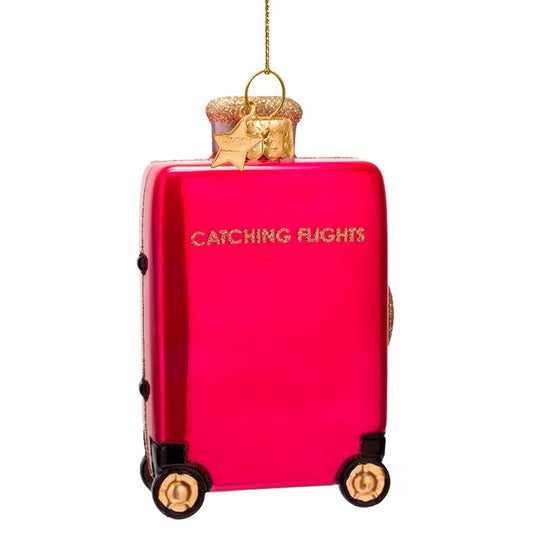 Ornament glass raspberry pink catching flight suitcase