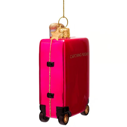 Ornament glass raspberry pink catching flight suitcase